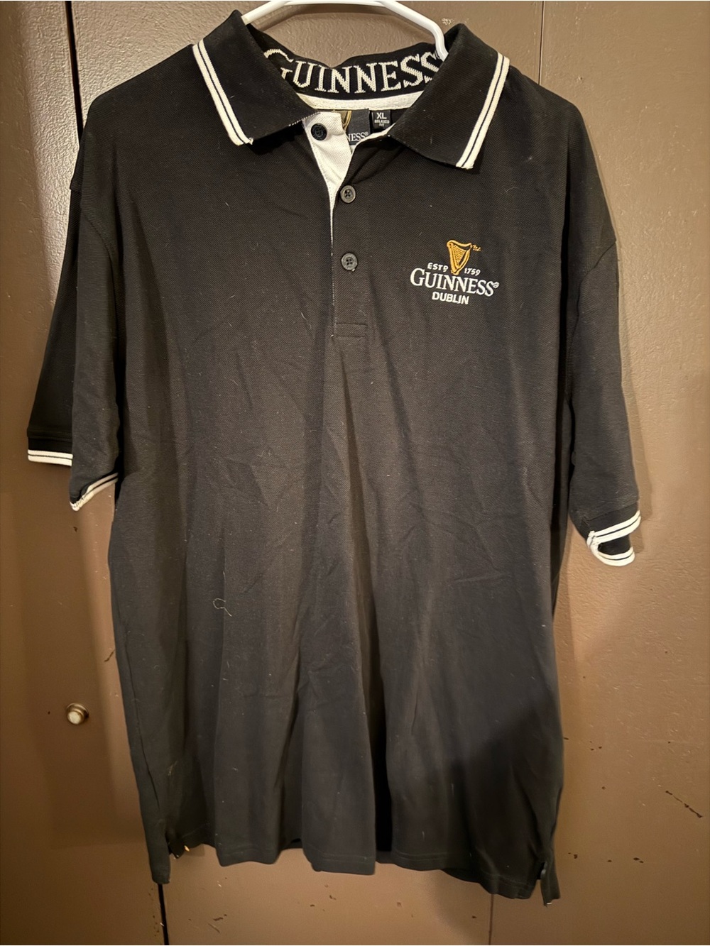Guinness Black Polo with White Trim and Gold Harp Embroidery